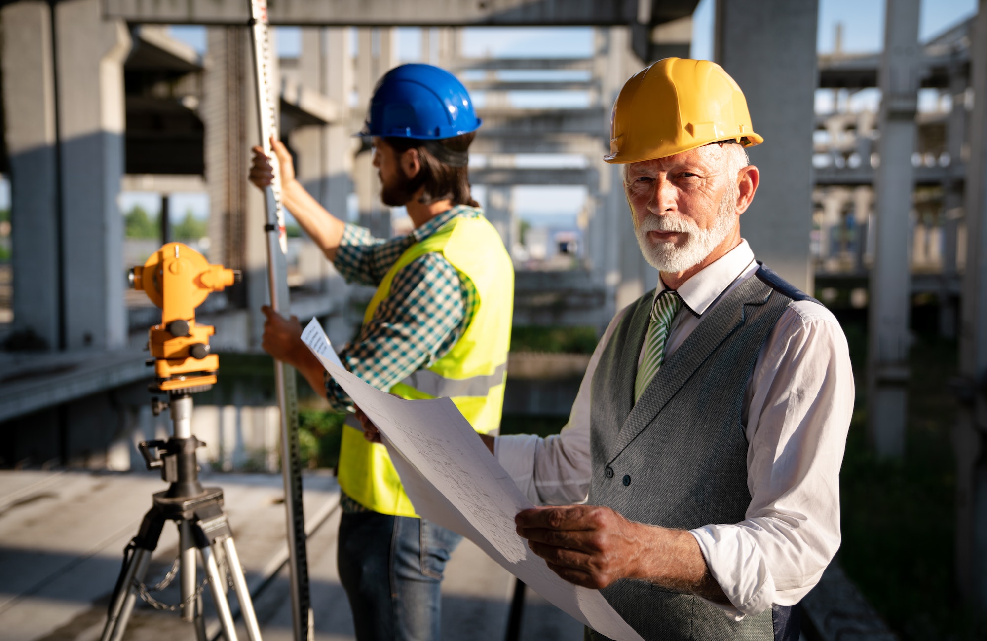 Team of construction engineers, architects working on building site