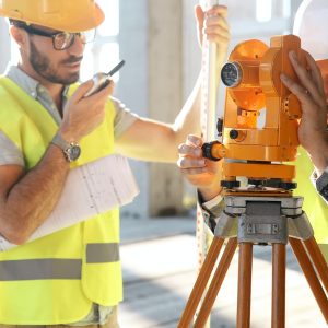 Team of construction engineers working on building site